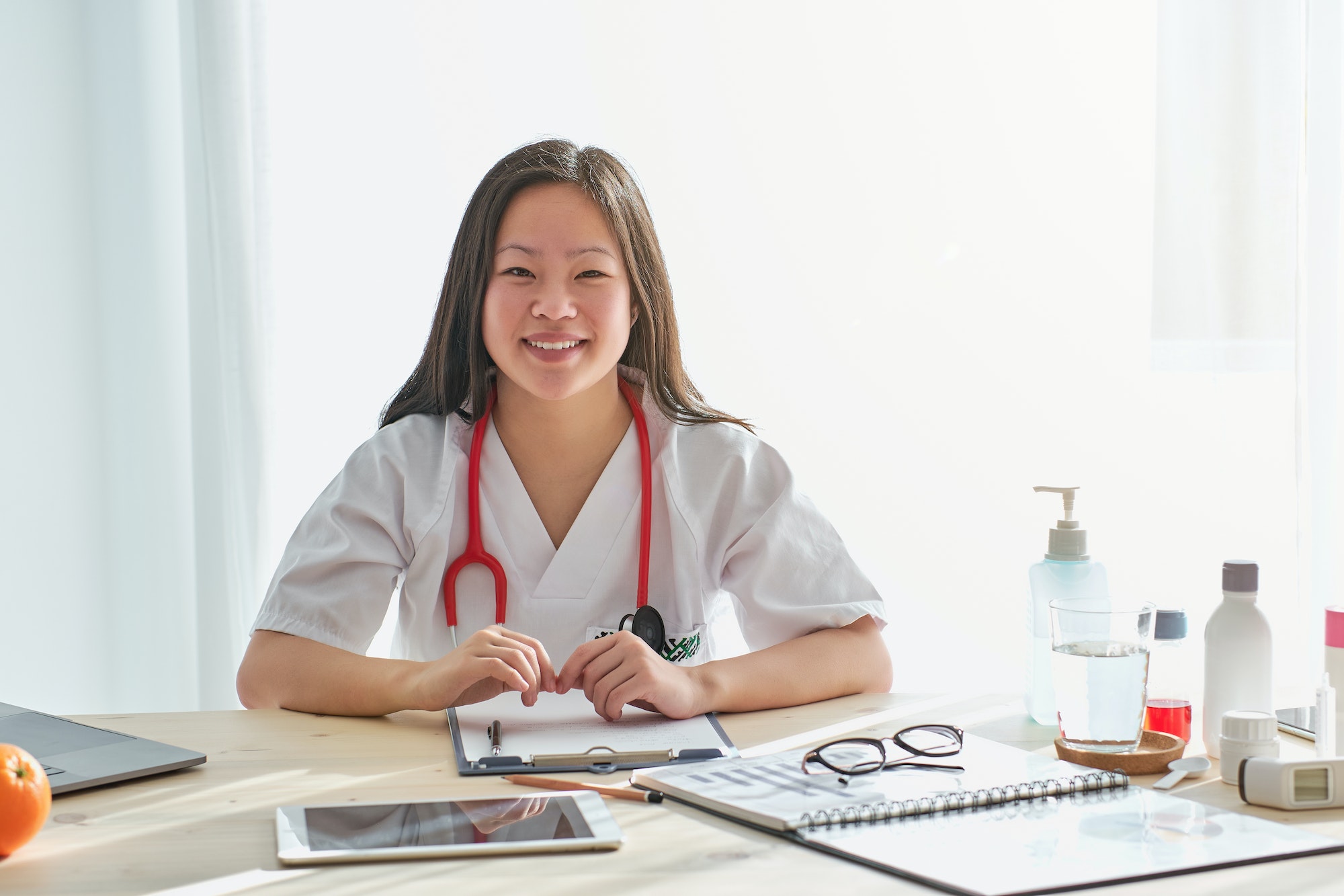 Delighted Asian medic in clinic